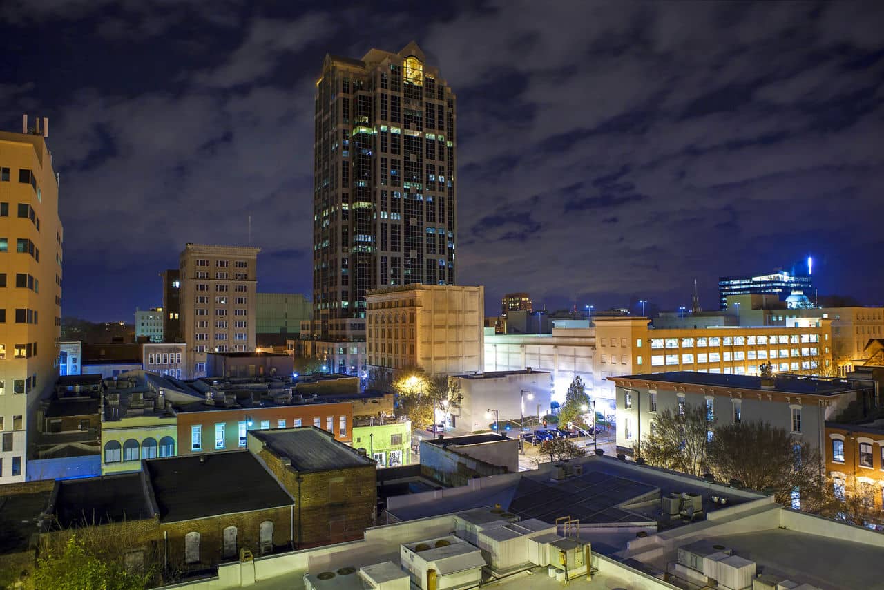 Urban rooftop view of Raleigh, North Carolina at night