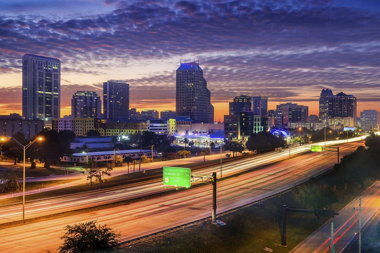 Orlando, Florida, USA skyline over the highway.
