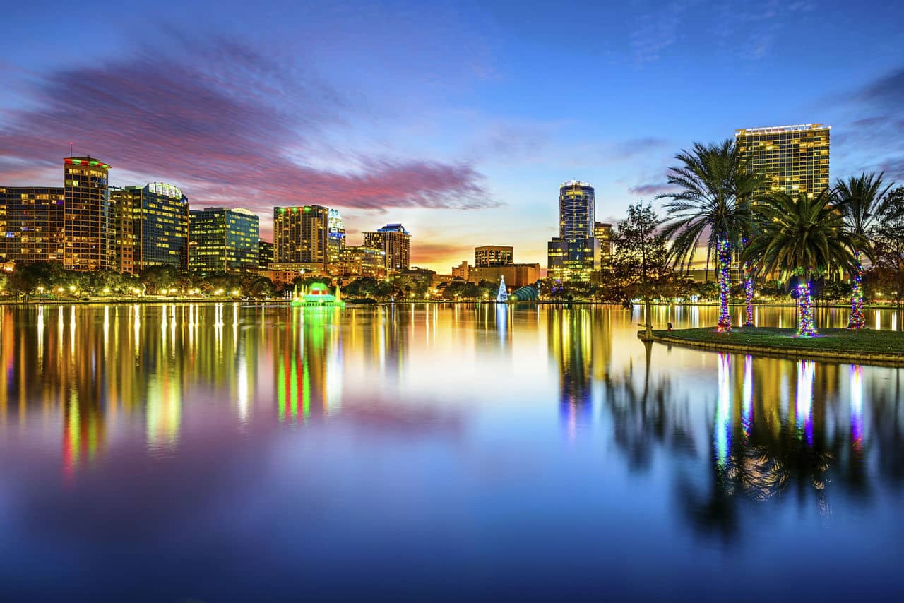 Orlando, Florida, USA downtown city skyline on Eola Lake.