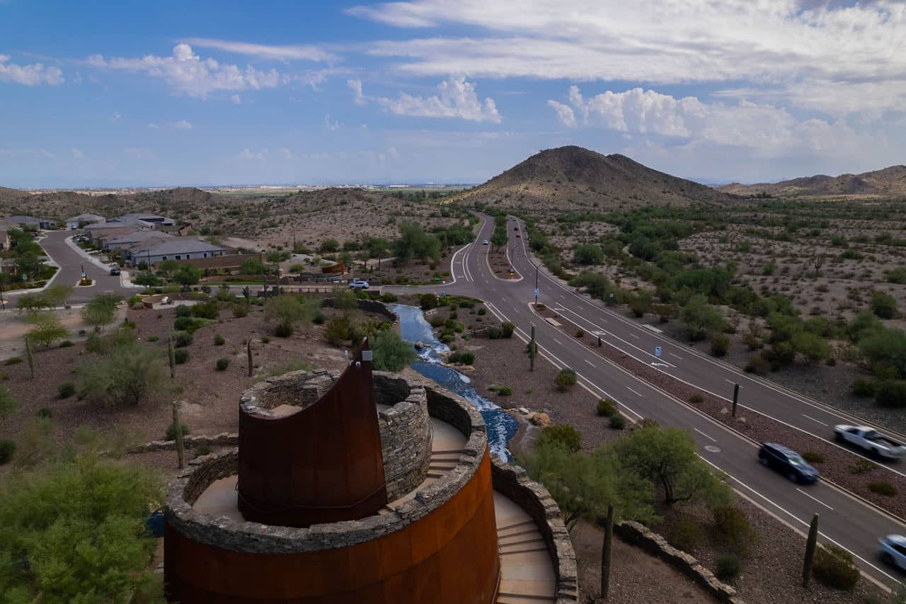 Goodyear and Avondale Arizona desert landscape with scenic roadway, desert vegetation and mountain views - Phoenix West Valley suburban neighborhood