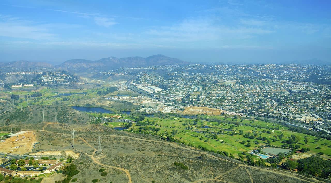Aerial view of Mission Valley neighborhood, San Diego in Southern California, United States of America. A wide river valley trending east-west in San Diego, through which the river flows to the Pacific Ocean.