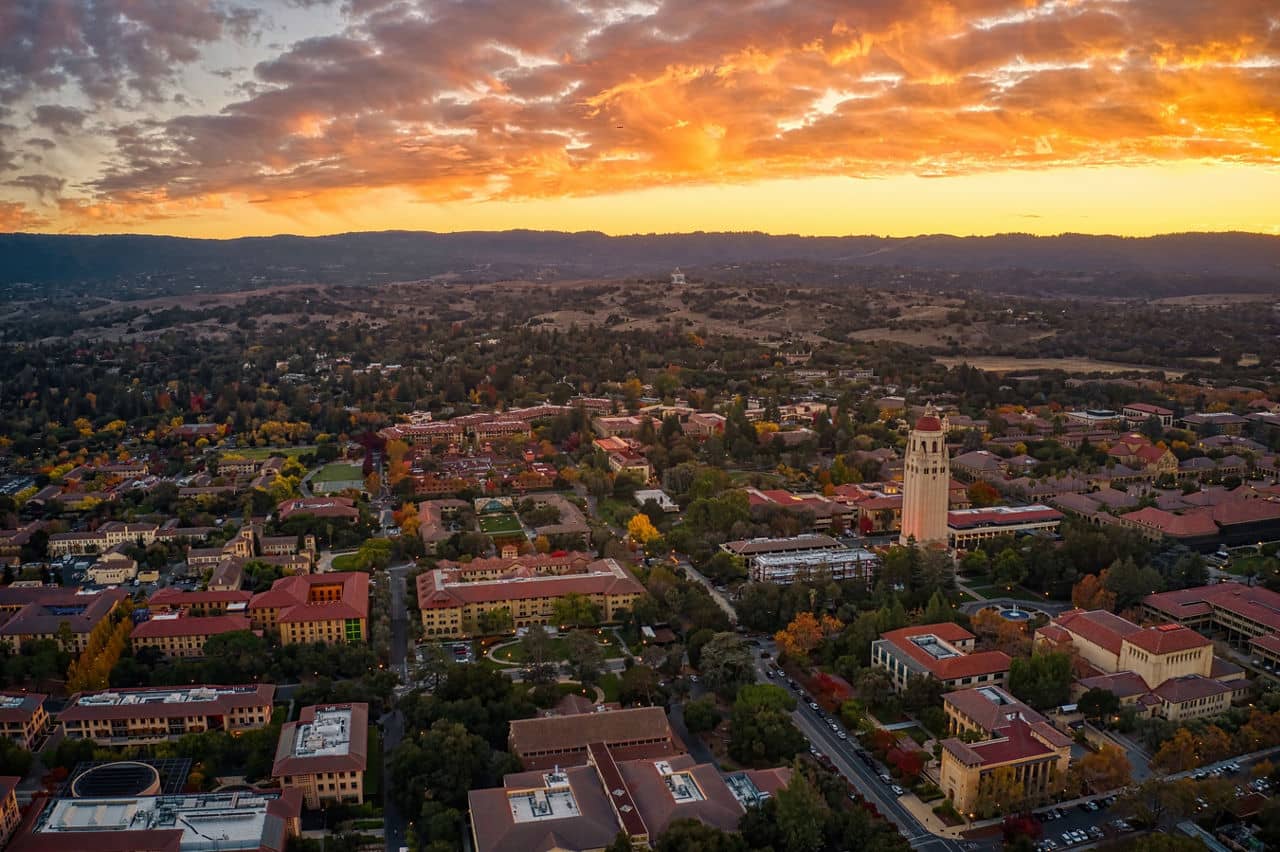 Aerial of Downtown Palo Alto, California at sunset featuring part of a college campus