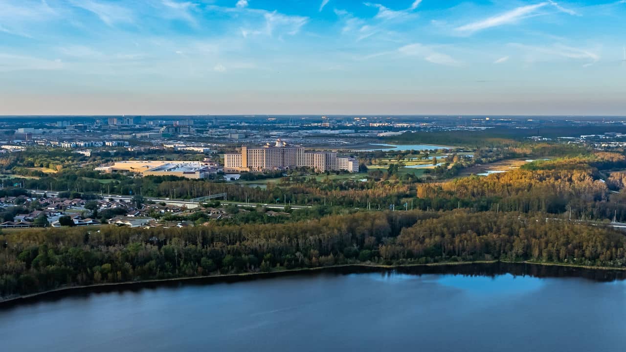 Aerial view of Grande Lakes, Florida showing the skyline, lake, and trees on a beautiful day 