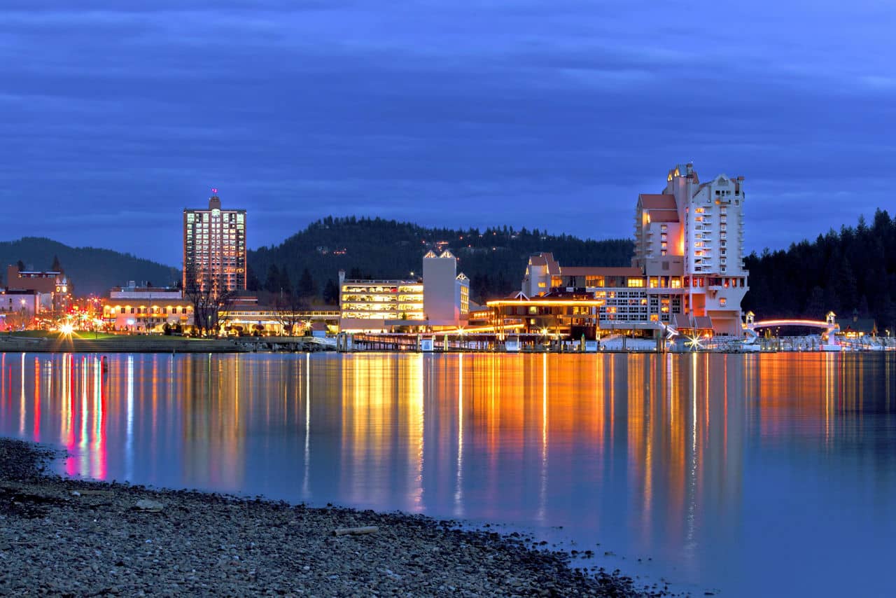 The view of downtown Coeur d'Alene early in the evening from the beach area.