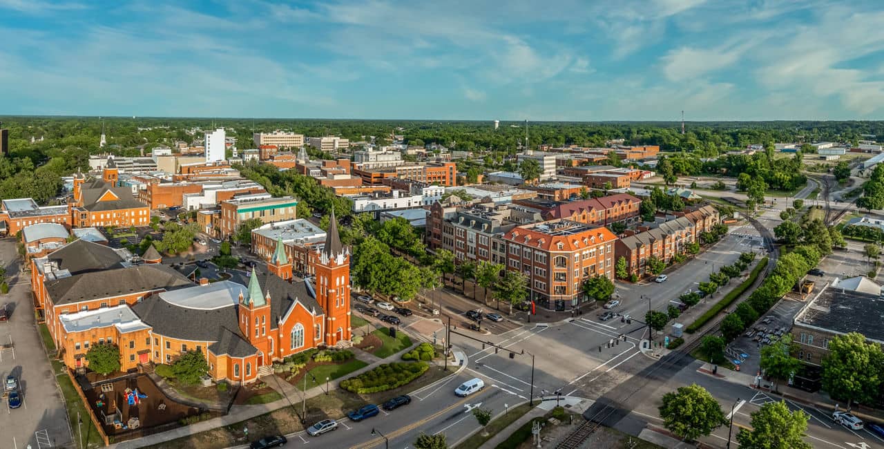 Downtown Fayetteville North Carolina aerial view with historic church and urban apartments - Fayetteville NC living