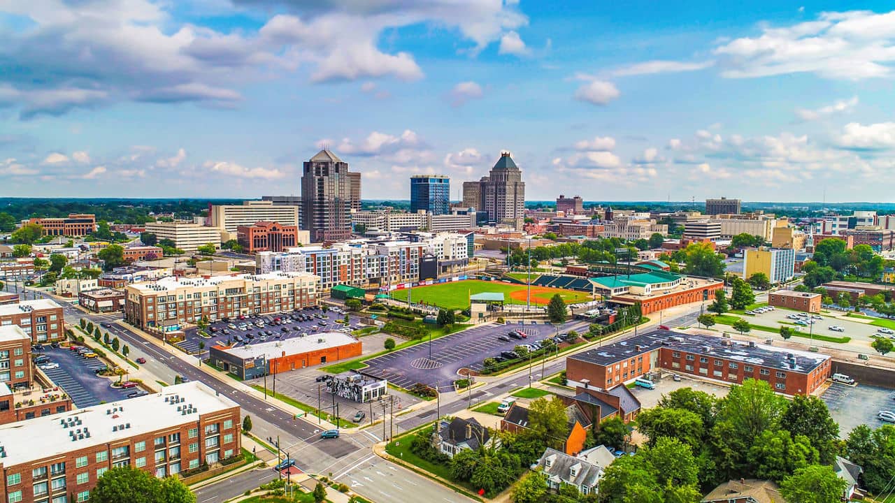 Aerial view of the Greensboro, NC skyline at dawn on a summer morning in Greensboro, North Carolina.