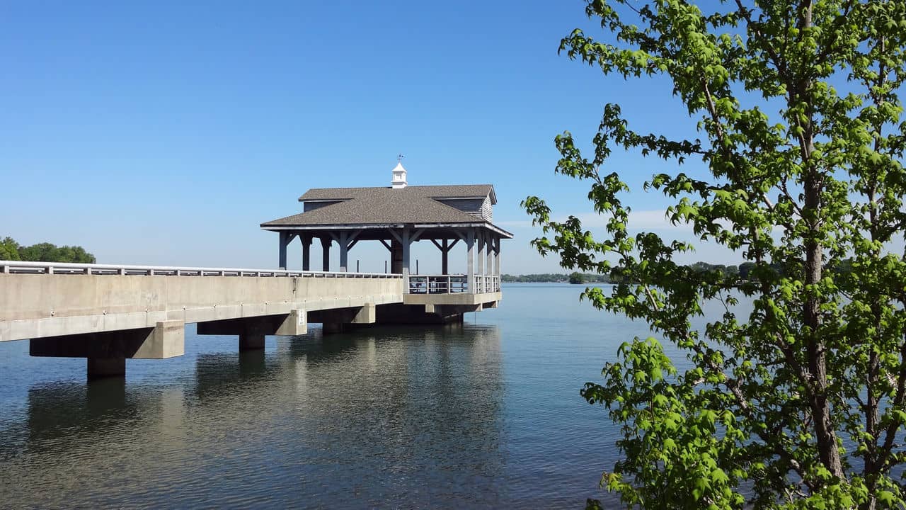 Scenic wooden pier extending into the calm water of Lake Norman at Blythe Landing, Huntersville, NC.