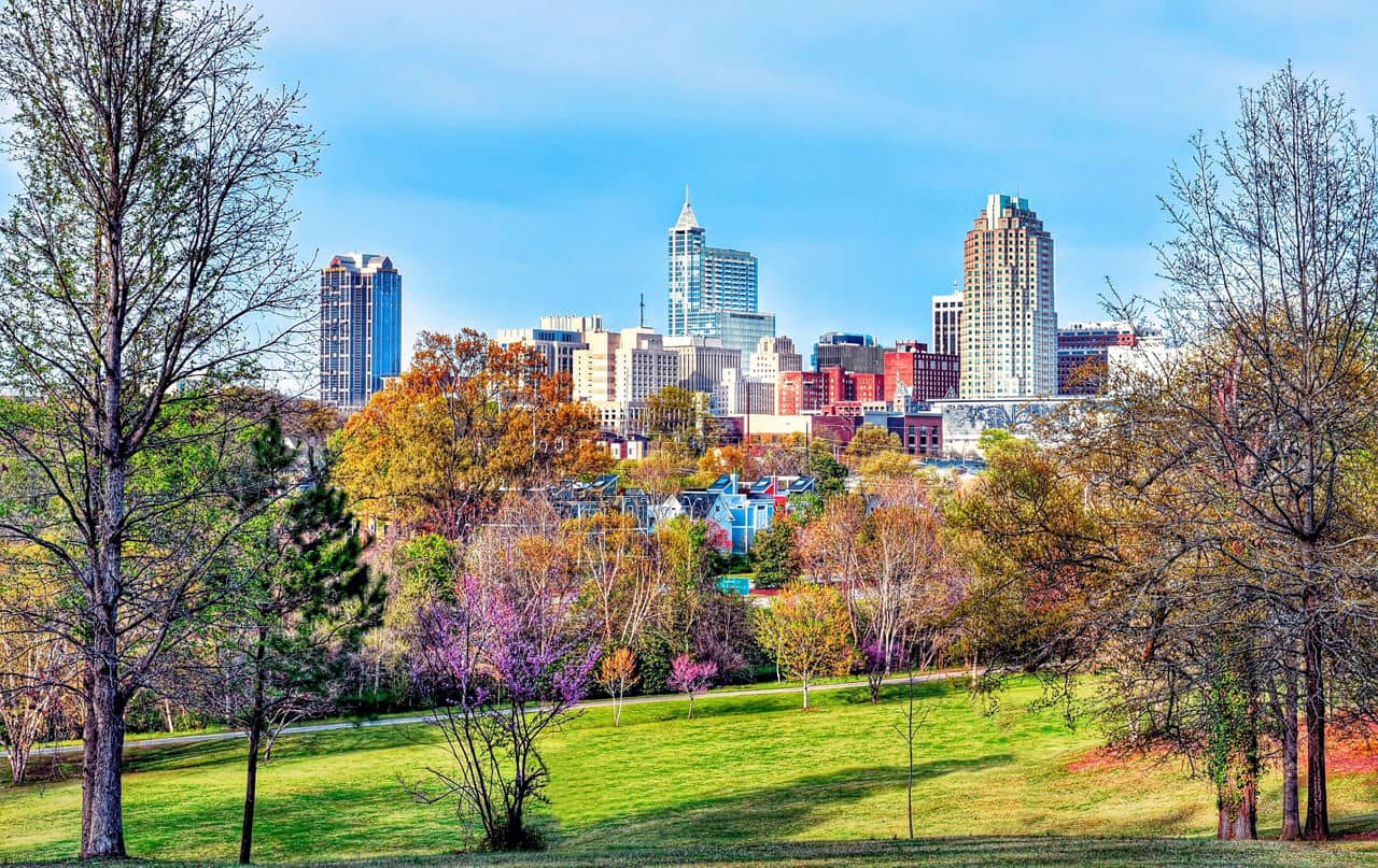 A colorful, high-definition HDR cityscape showing the vibrant downtown Raleigh, North Carolina skyline.