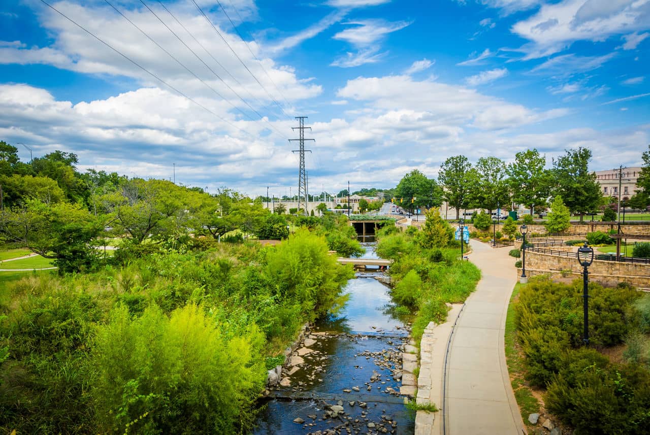 View of the Little Sugar Creek Greenway and a paved walkway in Elizabeth Park, which is in Charlotte, North Carolina.