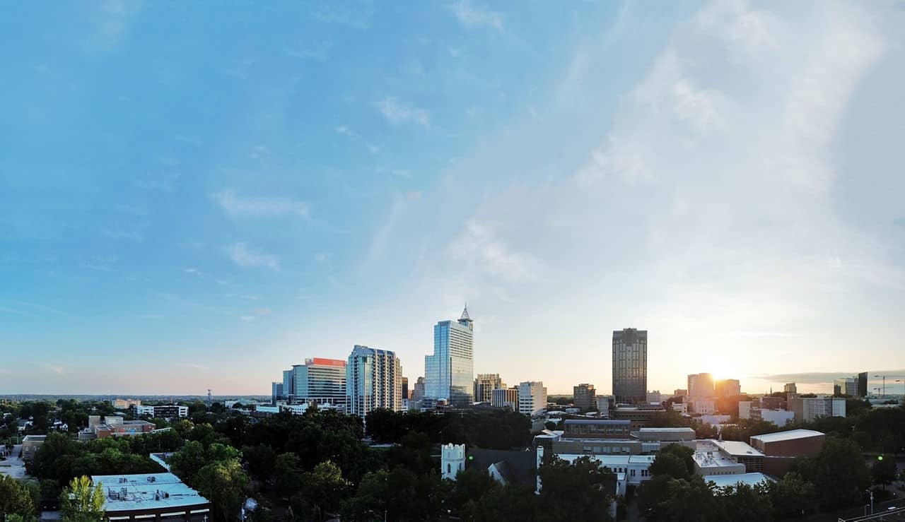 Raleigh NC downtown skyline from West Raleigh showing urban apartments and green spaces - Wake County living
