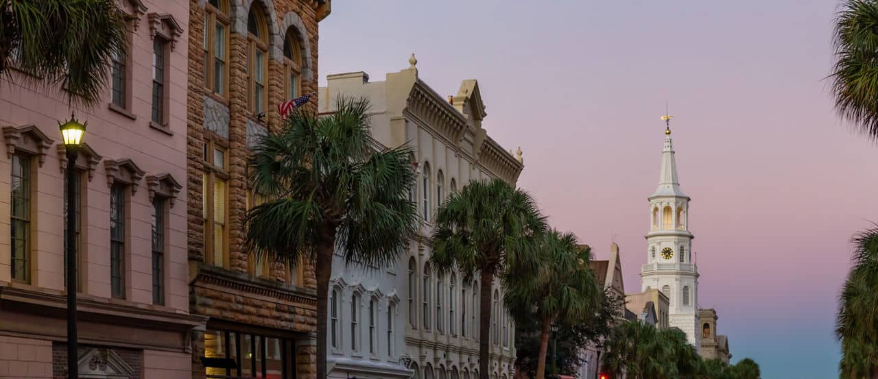 Beautiful panoramic view on the uban streets in Downtown Charleston, South Carolina, United States. Taken during a vibrant sunrise.