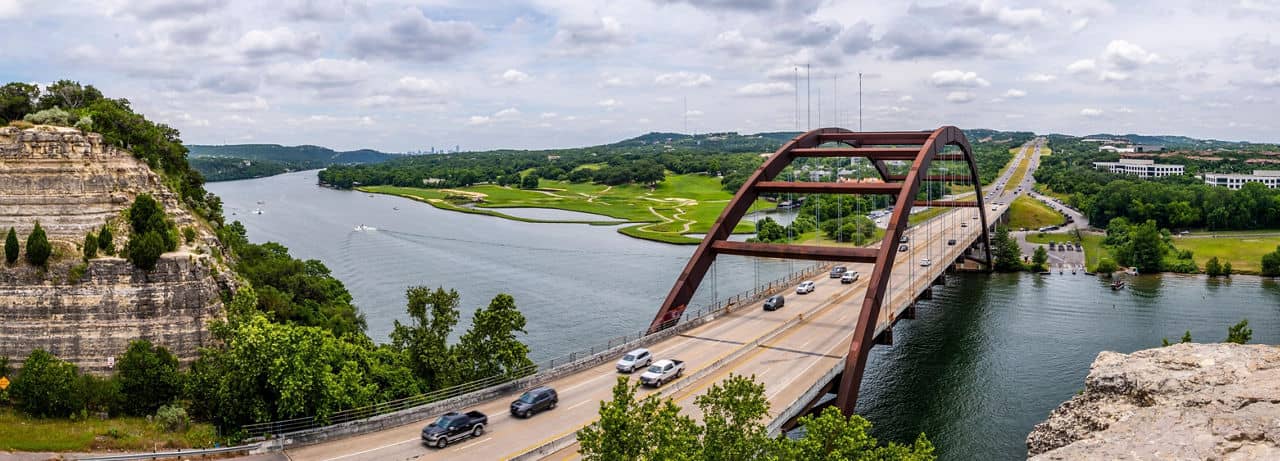 An ariel view of cars crossing over a bridge in West Austin, Texas