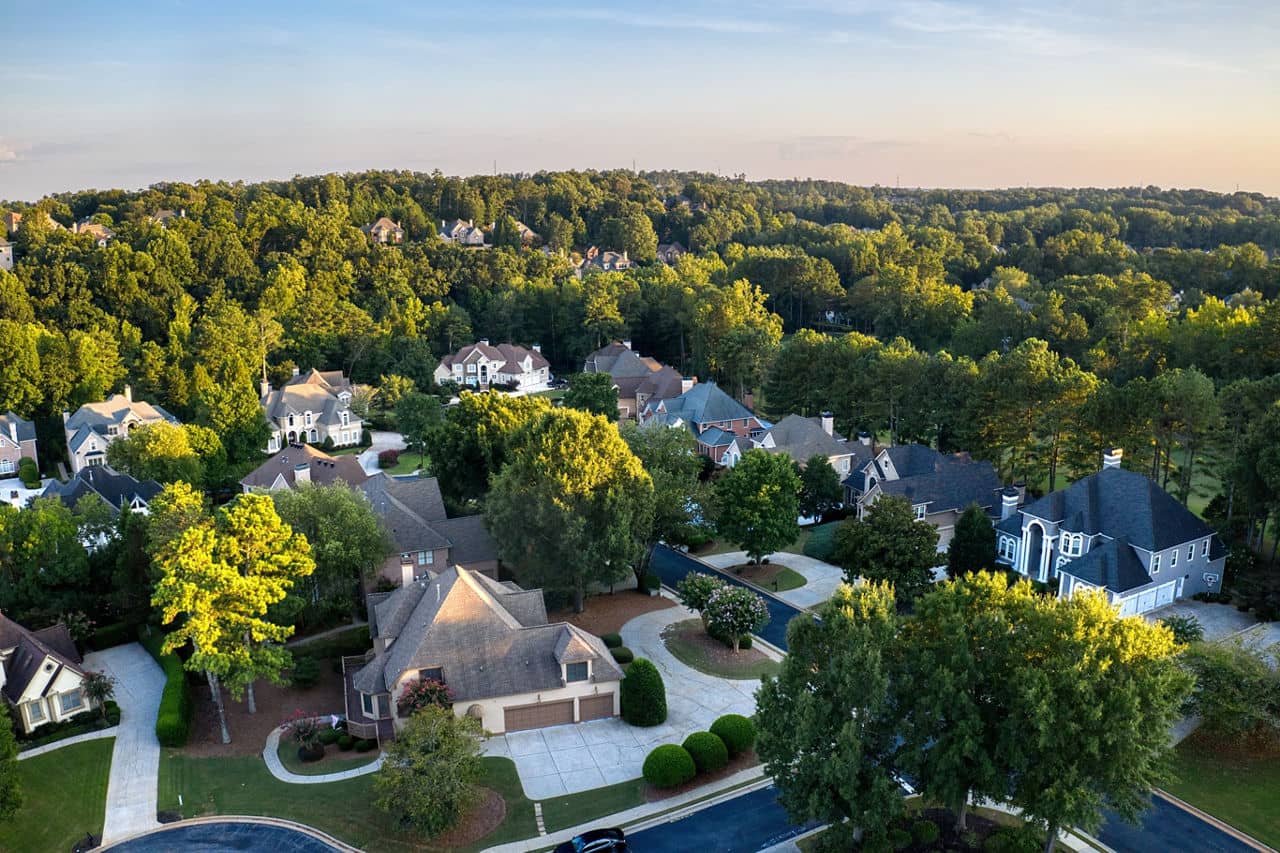 Aerial view of an upscale suburban subdivision iR during Golden hour