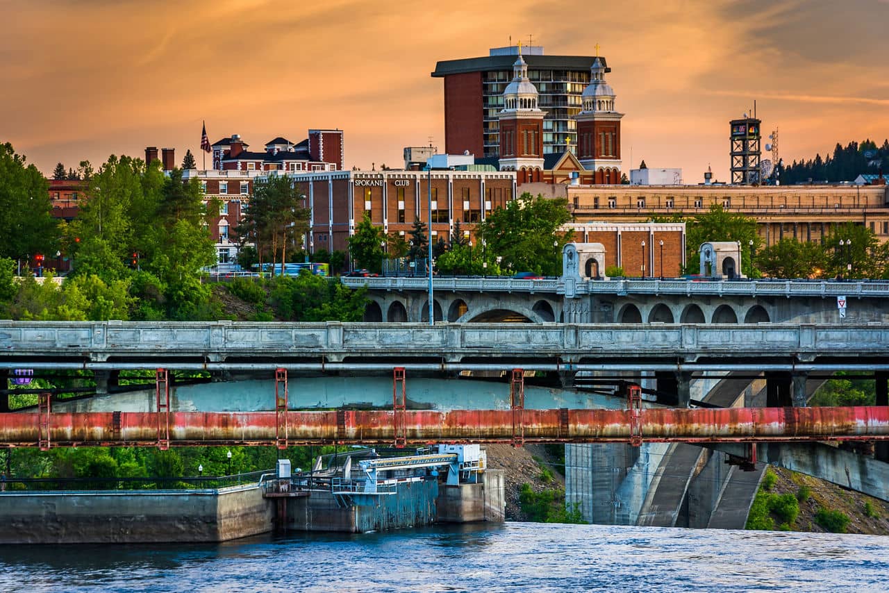 Bridges over the Spokane River and buildings at sunset, in Spokane, Washington.